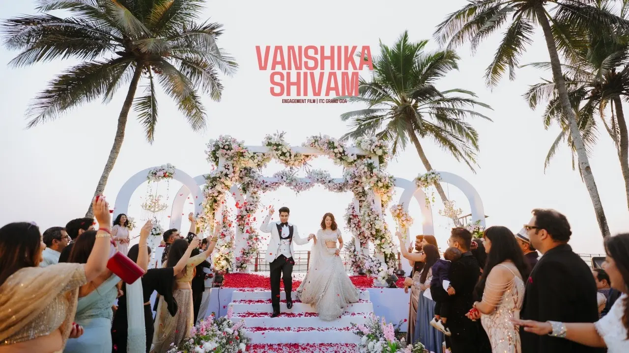 Vanshika and Shivam walking down a petal-strewn aisle at ITC Grand Goa, from their engagement film by Fog Media